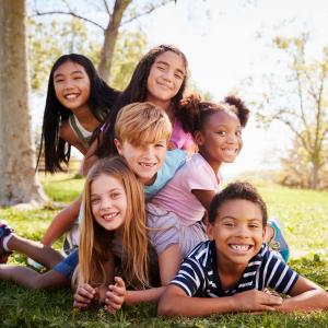 multi-ethnic-group-of-kids-lying-on-each-other-in-2024-10-21-03-37-22-utc