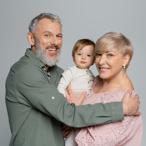 overjoyed-grandparents-looking-at-camera-near-belo-2023-11-27-05-20-27-utc